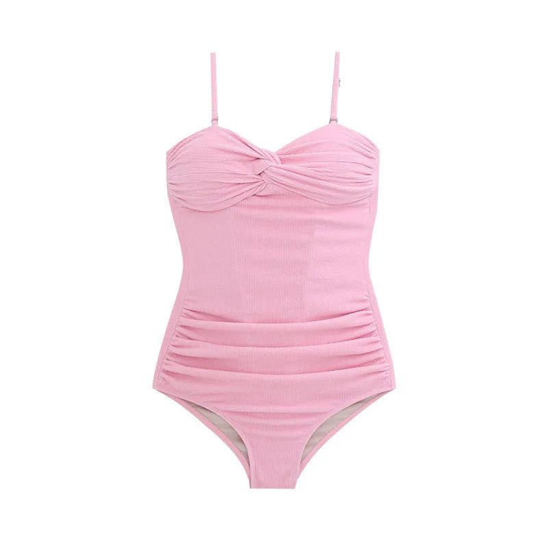Women's black suspender-style one-piece swimsuit with high waist and push-up support