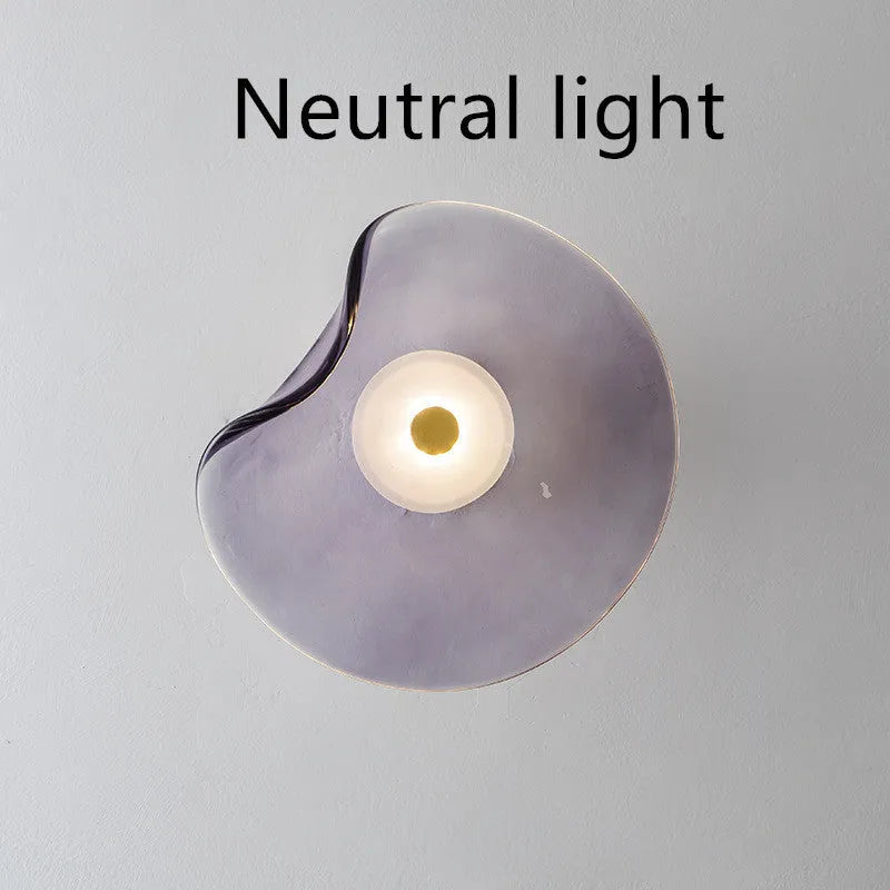 Round glass wall lamp in cognac colour with diffused lighting for bedroom bedside decoration