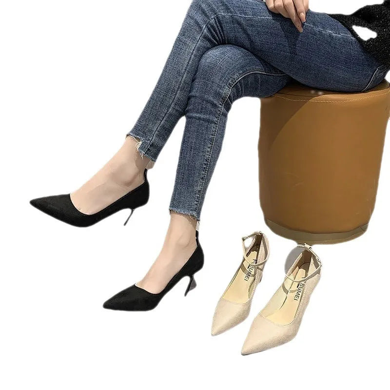 Women's black stiletto pump shoes with skull pattern and buckle detail on 8cm heel