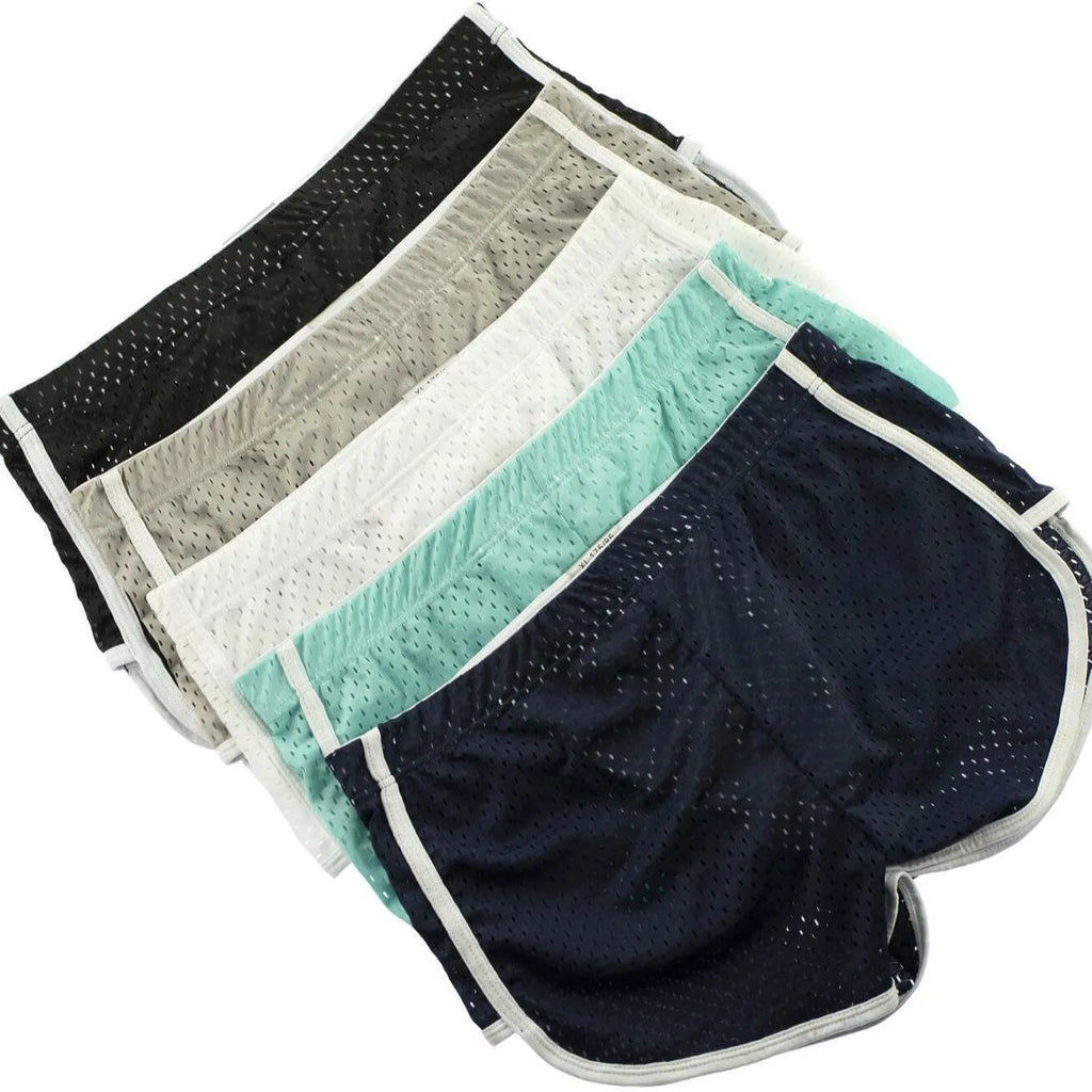 Men's black boxer shorts showing three-point ventilation panels and a mid-waist design.