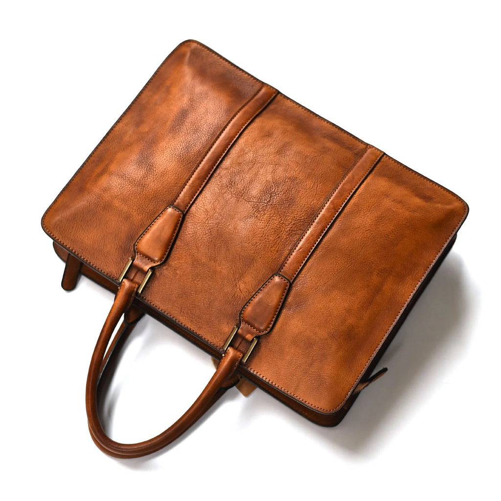 Men's brown leather business handbag with horizontal square shape and zipper opening