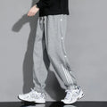 Men's loose-fit sportswear trousers with ankle tie detail in cotton blend fabric