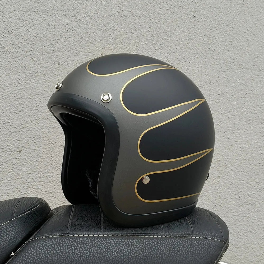 Glass fibre retro half motorcycle helmet shown in multiple colour options including cement grey and matte black flower patterns