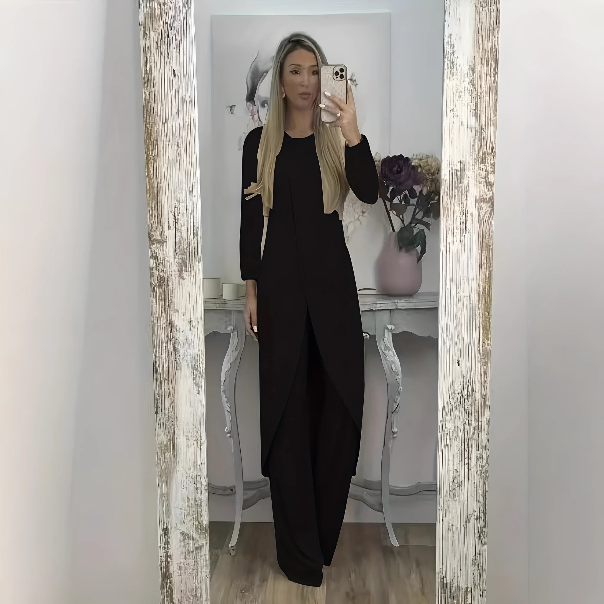 Casual black long sleeve round neck top and loose trousers two-piece lounge wear set.