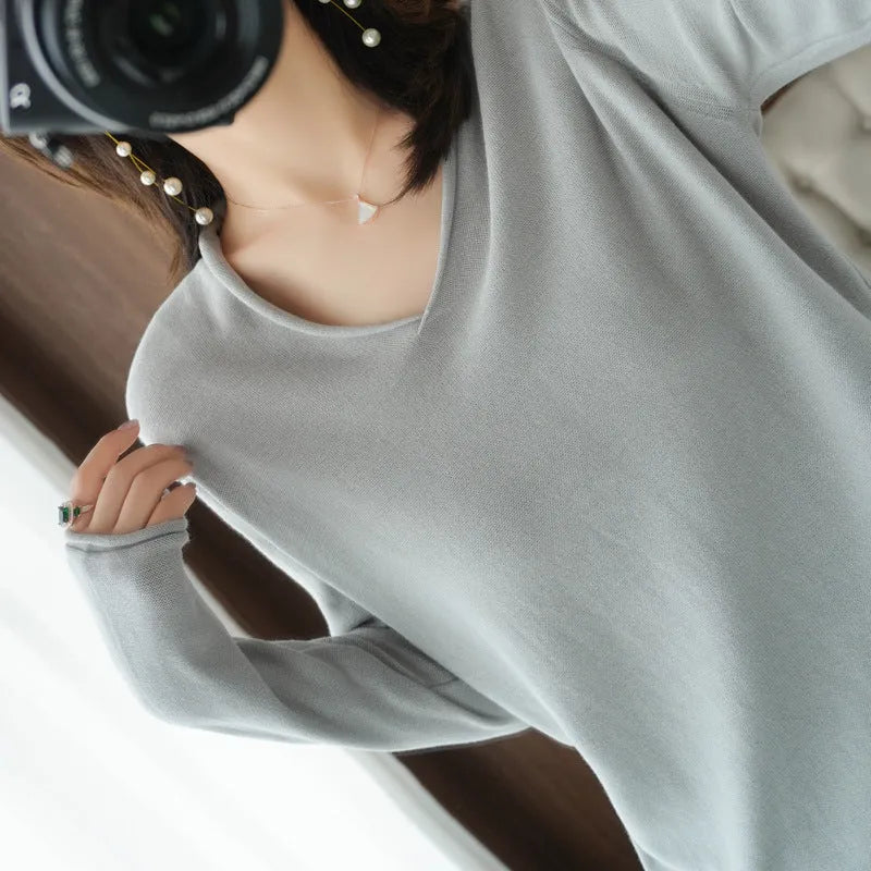 Women's long sleeve V-neck knitwear pullover top in a choice of ten colours on a hanger.