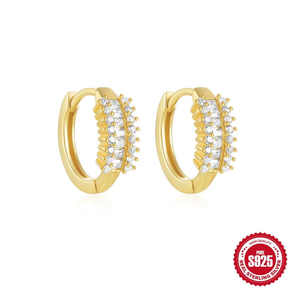 Small round geometric sterling silver stud earrings with a diamond shape, available in gold or silver finish.