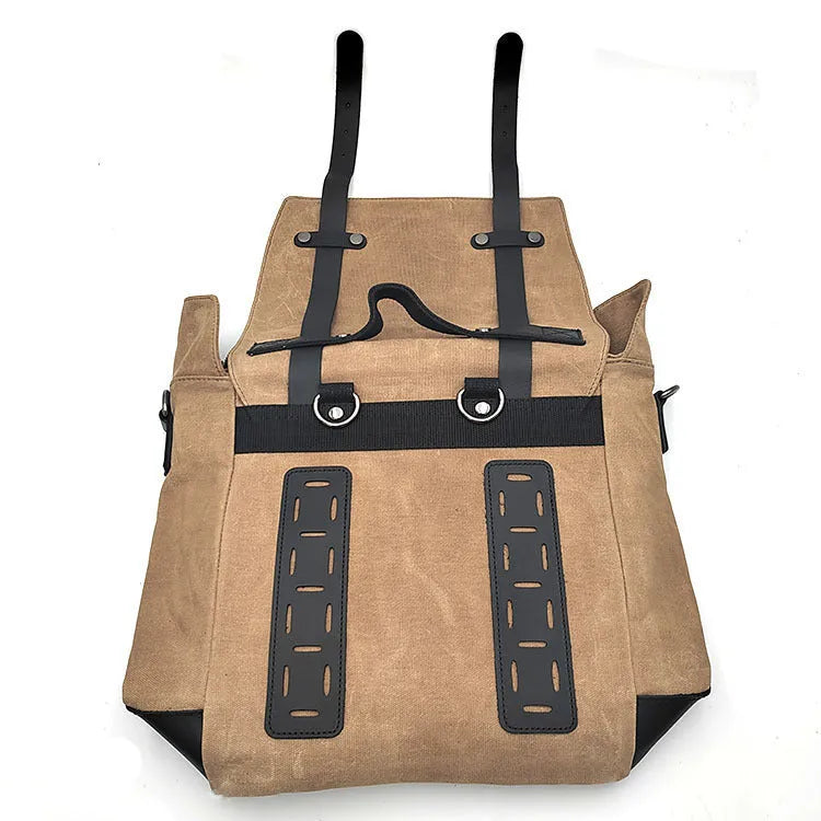Black waterproof canvas motorcycle side pannier bag with cowhide accents showing mounting straps