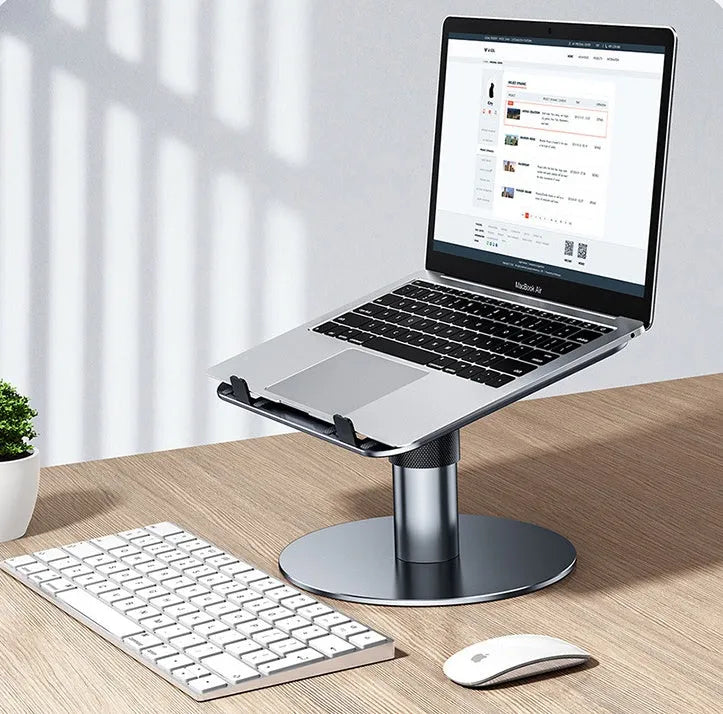 Aluminium car laptop stand in silver, showing adjustable height and rotating base with non-slip silicone pads.