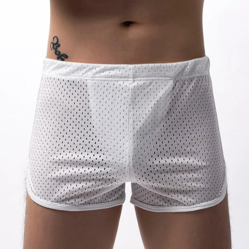 Men's black boxer shorts showing three-point ventilation panels and a mid-waist design.