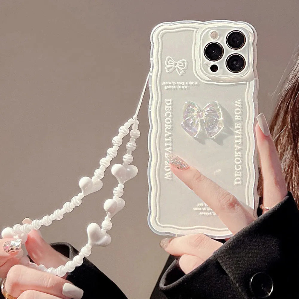 Transparent TPU iPhone case with three-dimensional ice-through bow design on white background