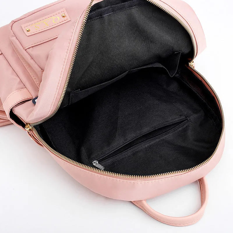 Women's black nylon casual backpack with multiple compartments and double shoulder straps