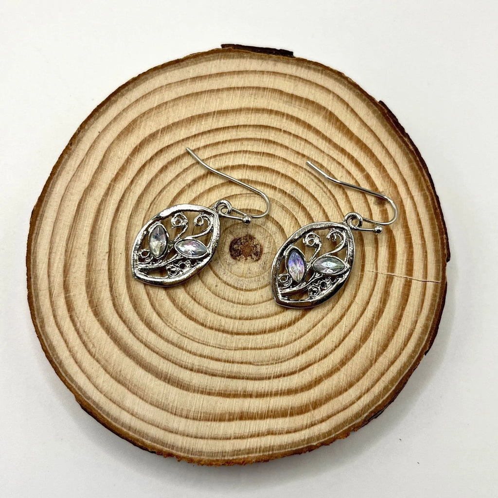 Women's silver colour leaves-shaped earrings with embedded moonstone stones and botanical design