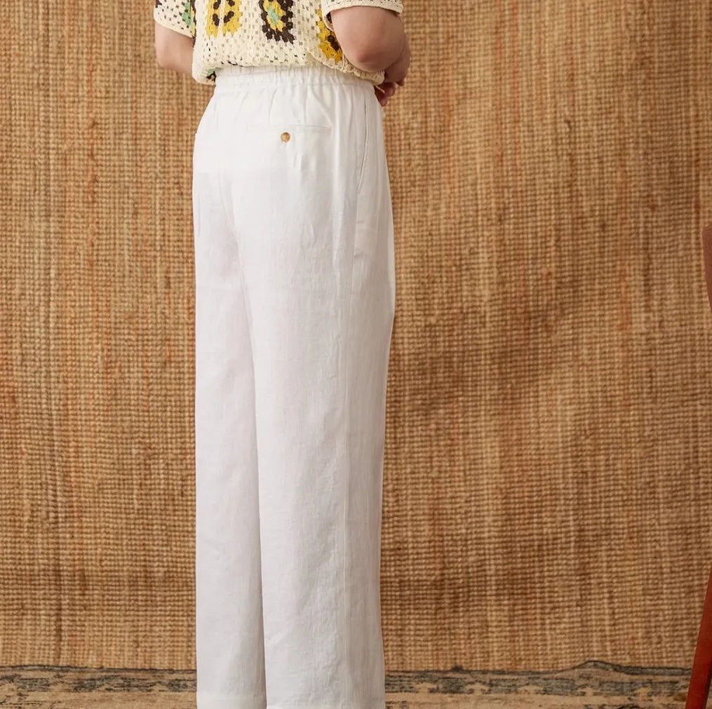Women's linen high waist trousers with elasticated waistband and straight leg cut in navy blue