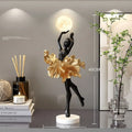 Small modern resin night lamp with USB charging port in black gold colour.