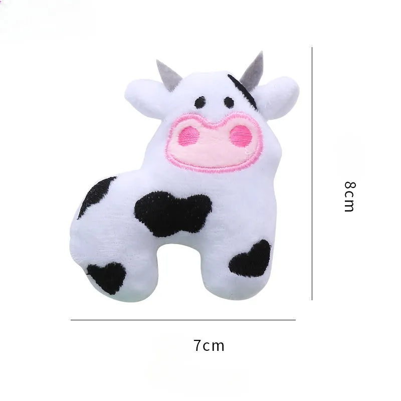 Cow shaped plush cat toy with catnip measuring approximately 20cm in length