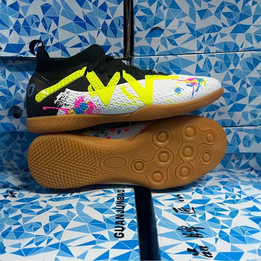 Low-top football shoes with studded rubber outsoles in black and yellow colour combination