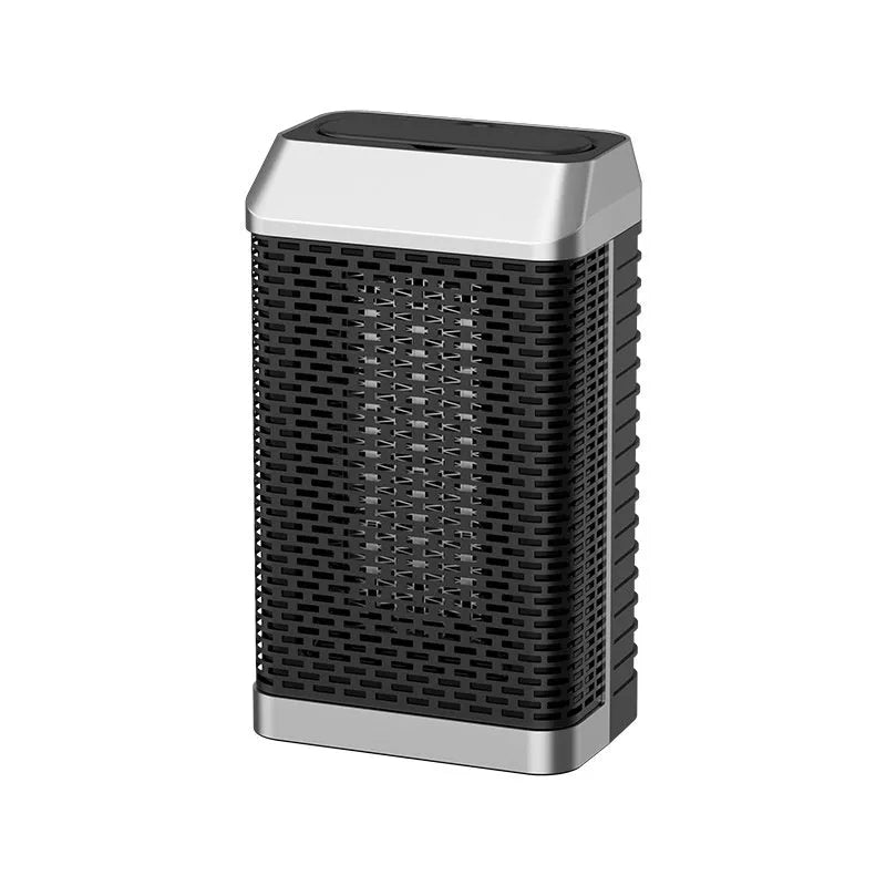 Black desktop warm air blower heater with remote control on wooden desk