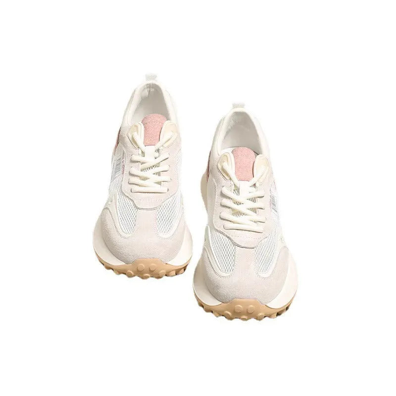 Women's grey and pink retro sneakers with mesh lining, rubber sole, and round toe design