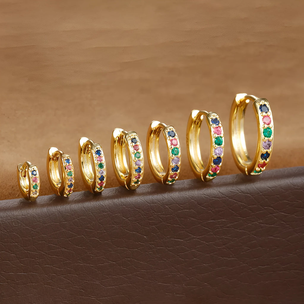 Circle perforated zircon stud earrings in gold, rose gold, and silver colour with geometric design
