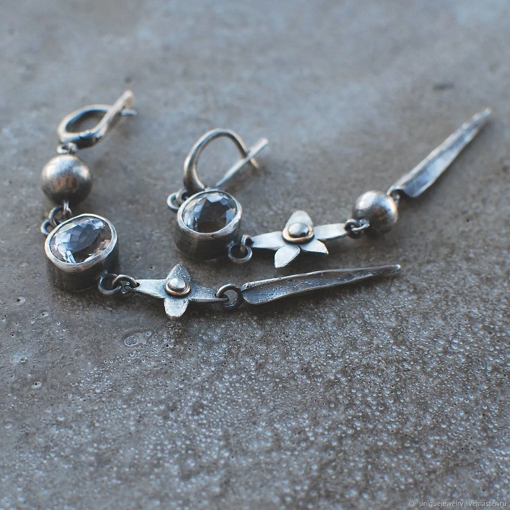 Geometric antique silver pendant earrings with XINGX design and rhinestone detailing