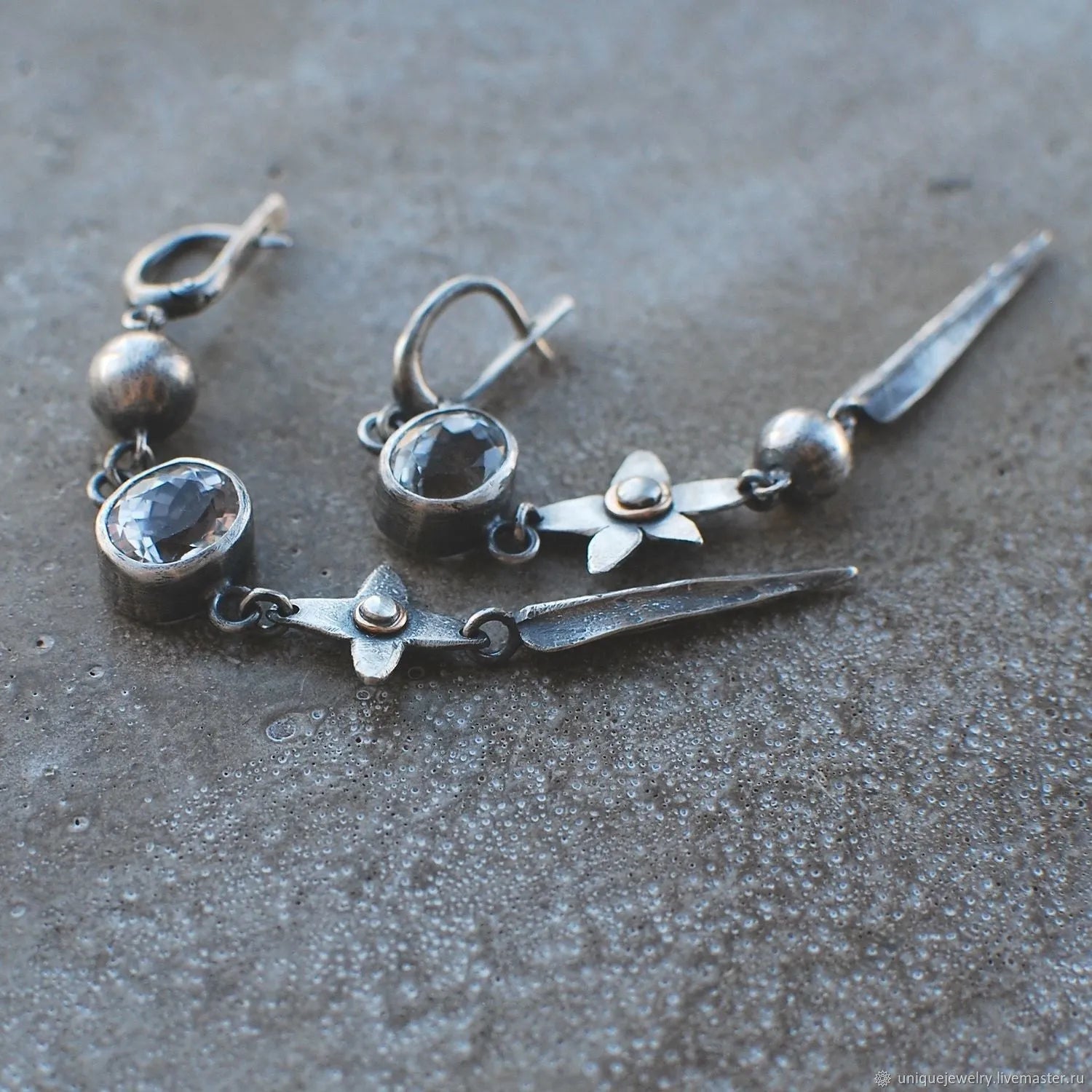 Geometric antique silver pendant earrings with XINGX design and rhinestone detailing