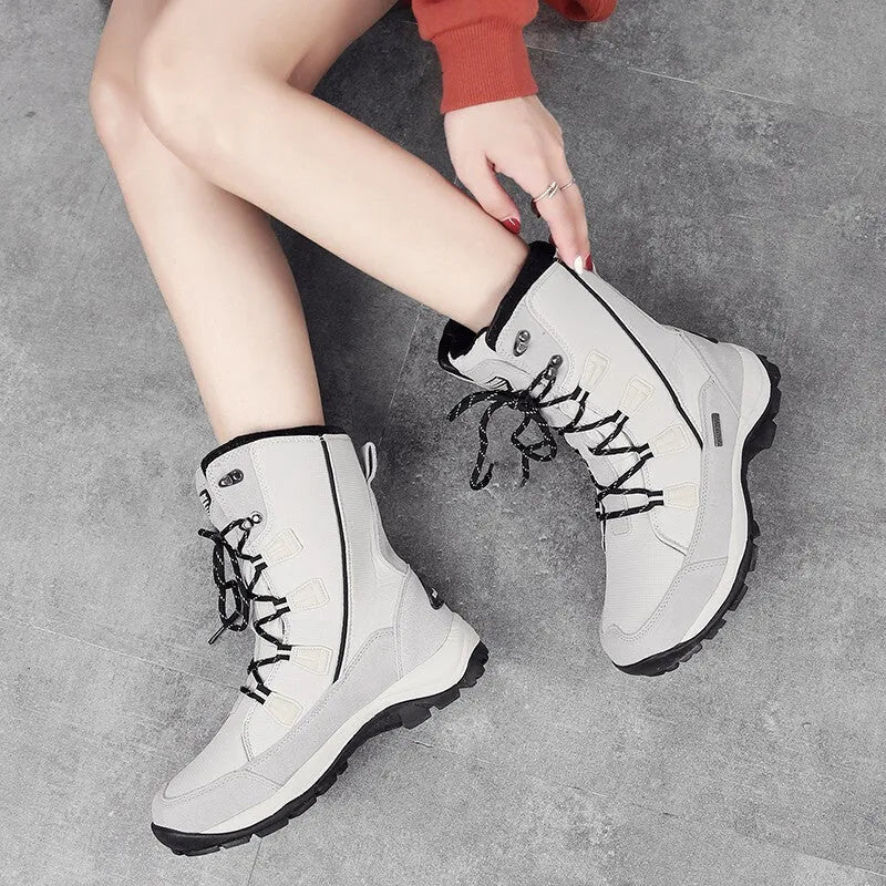 Women's black genuine leather mid-calf thermal snow boots with a rubber sole.