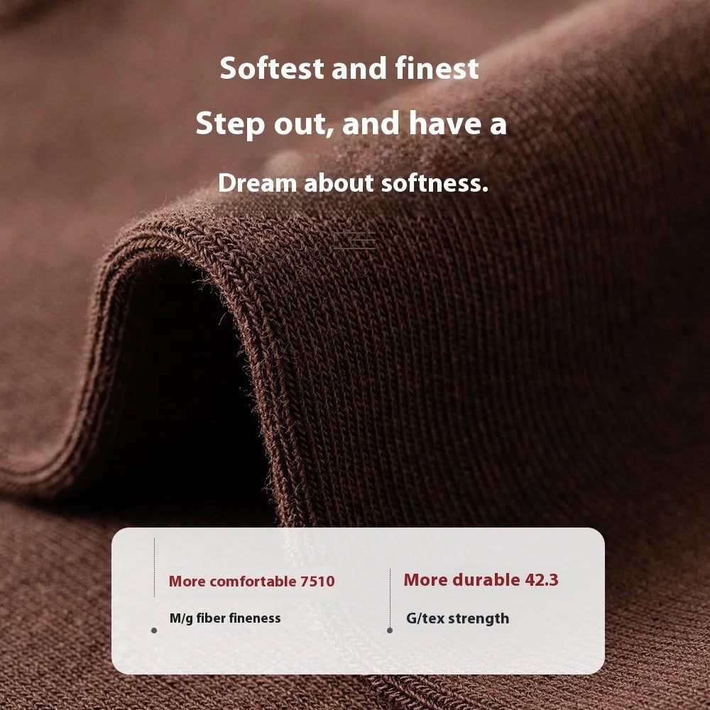 Men's solid colour pure cotton mid-calf business socks in beige, black, grey and blue shown folded.