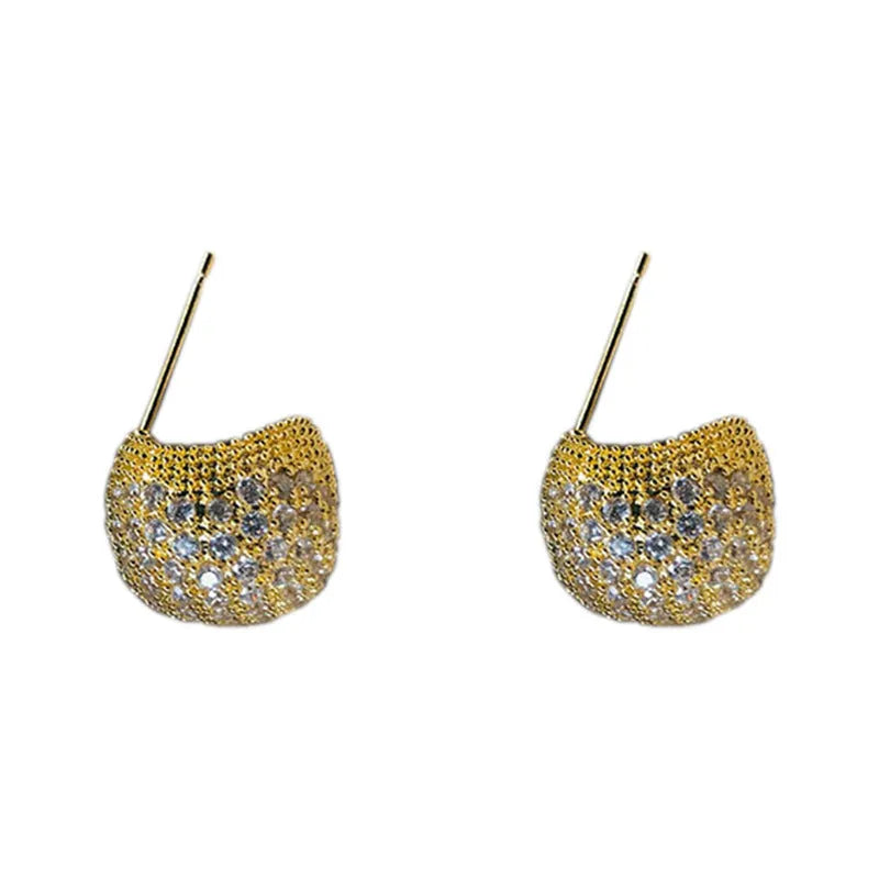 Geometric drop-shaped ear clips with full diamond detailing and sphere elements in gold and white colour options