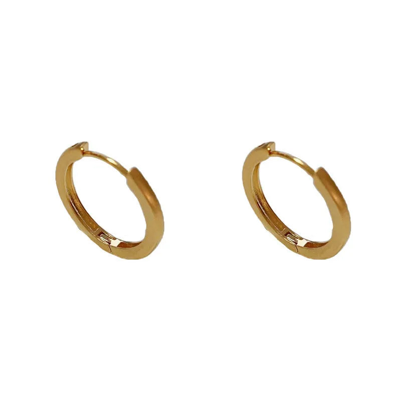 Geometric round ear clip jewellery with gold plating in minimalist style