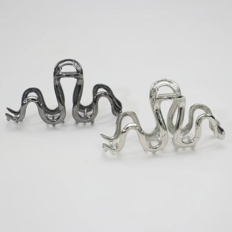 Silver Slytherin serpentine metal hair barrette measuring 10.5 cm in length.