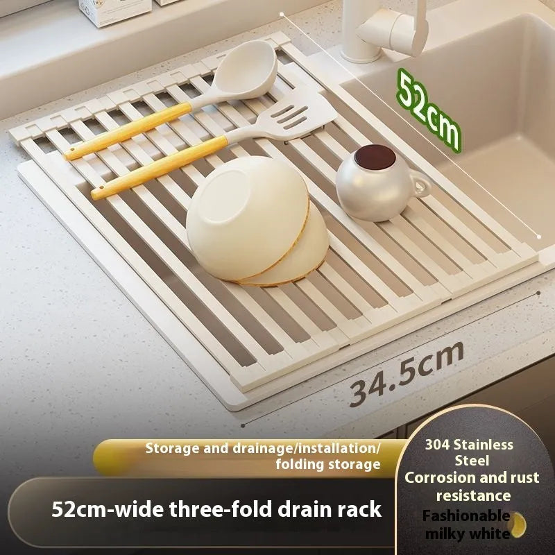 Milky white foldable stainless steel kitchen draining rack for dishes on a countertop