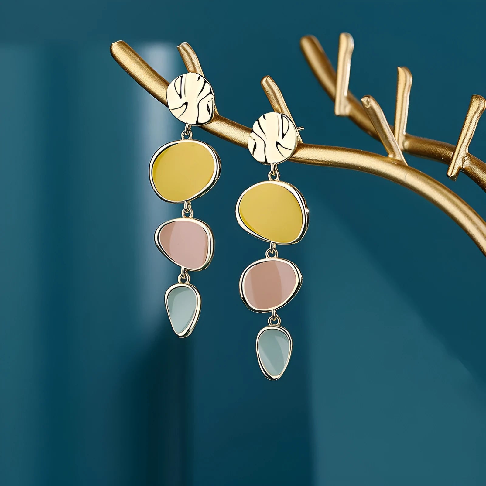 Pair of simple alloy disc earrings with a Morandi three-colour oil drip finish and sterling silver posts.