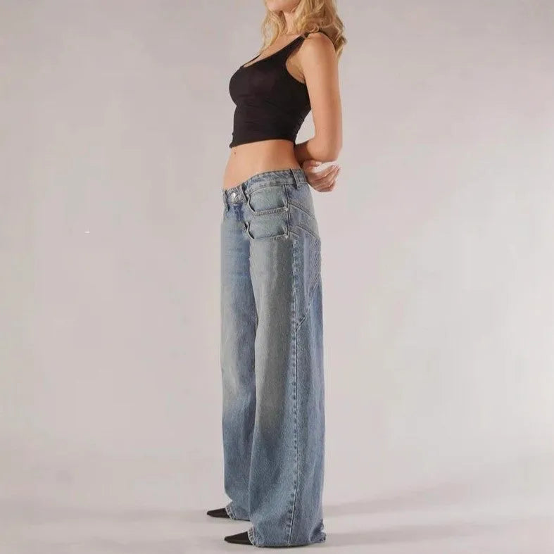 Women's blue cotton wide-leg mop trousers with a loose fit and low waist on a neutral background.