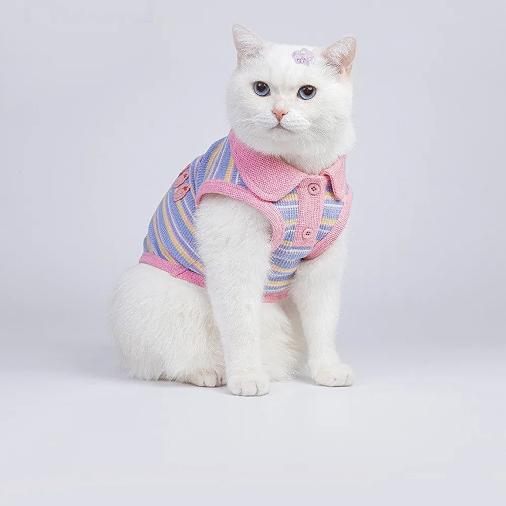 Pink purple autumn vest for a small dog or cat showing weight-based size tags from XXS to XXL.