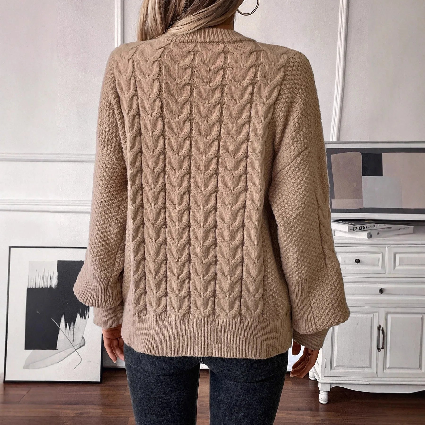 Women's khaki loose pullover sweater with round neck and twist detail on solid colour fabric