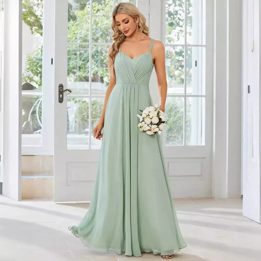 Women's long pleated sleeveless A-line dress in light green, shown on a mannequin.