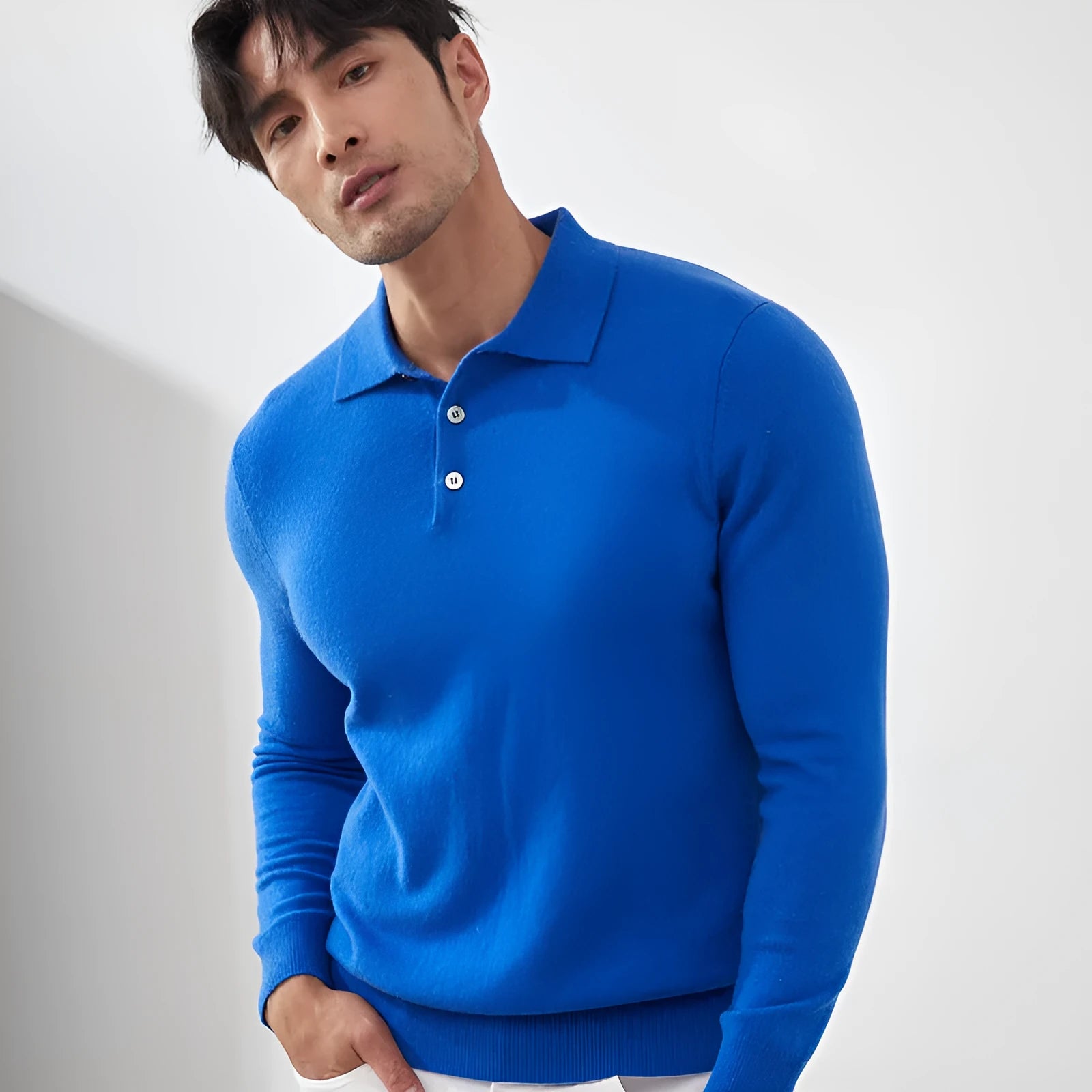 Man wearing a sapphire blue cashmere polo collar loose-fit pullover sweater