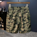 Men's camouflage cargo shorts with cargo pockets and loose fit design in cotton blend fabric