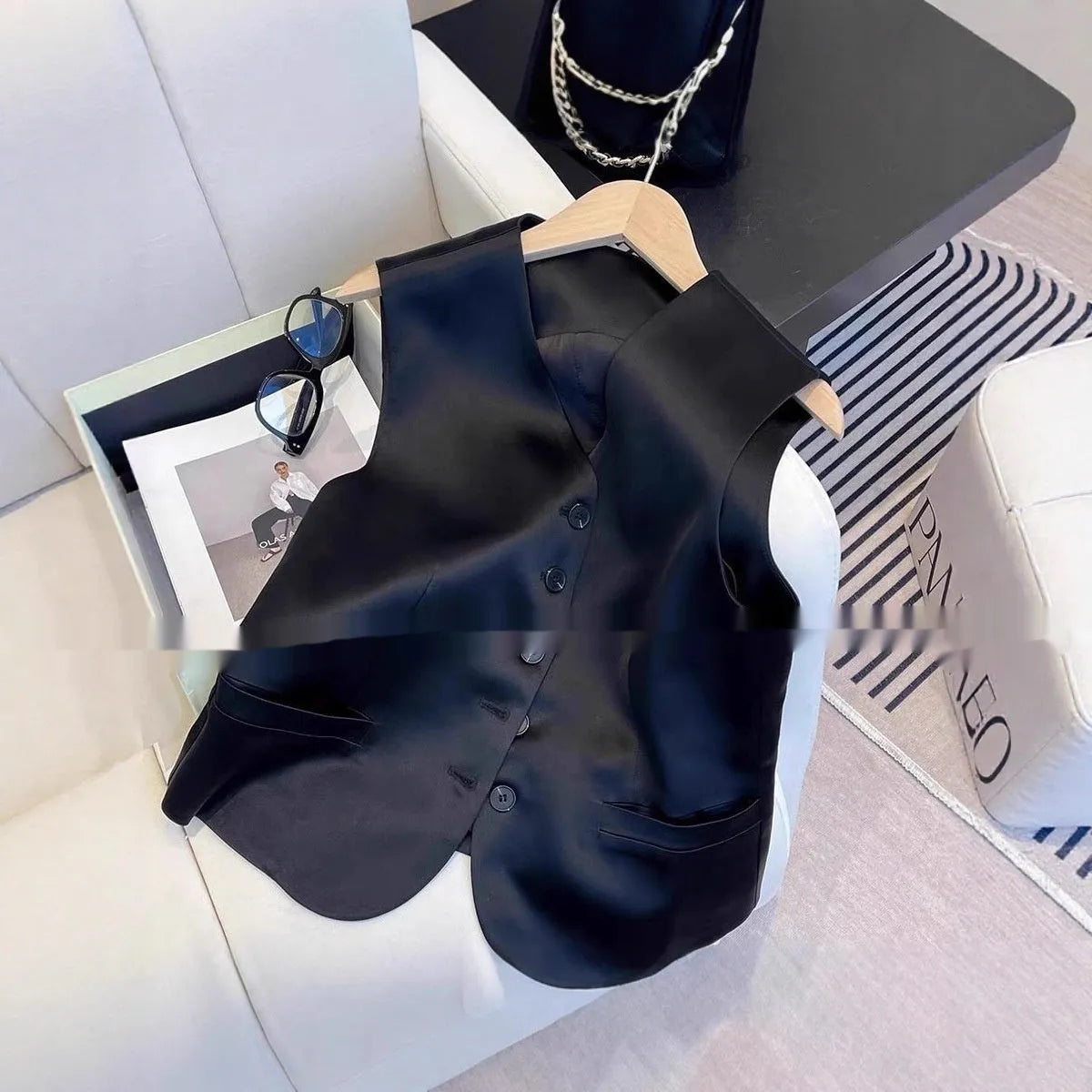 Black satin sleeveless vest with loose fit and splicing detail elements