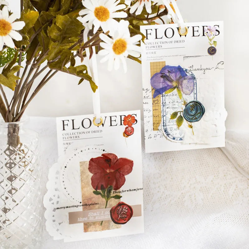 Package of 40 square dried flowers art sticker sheets in eight colour themes on a PET material base.