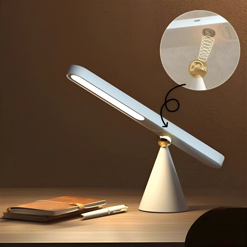 Geometric wireless table lamp with magnetic base in white colour showing touch controls