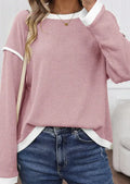Loose drop shoulder knit top with four leaf clover contrast trim at collar and sleeves