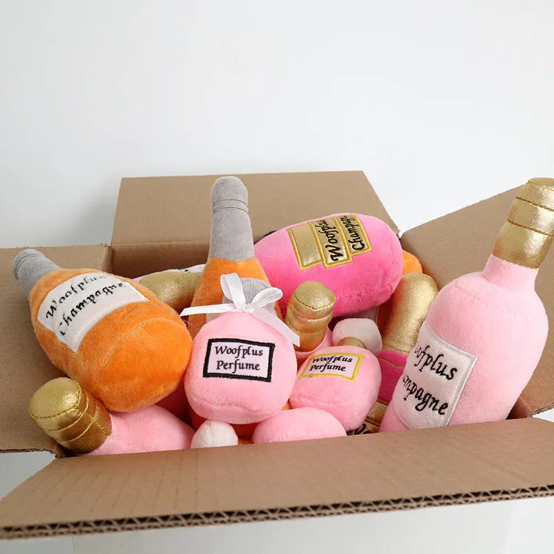 A plush fabric pet toy shaped like a wine bottle, shown in a green colour variant.
