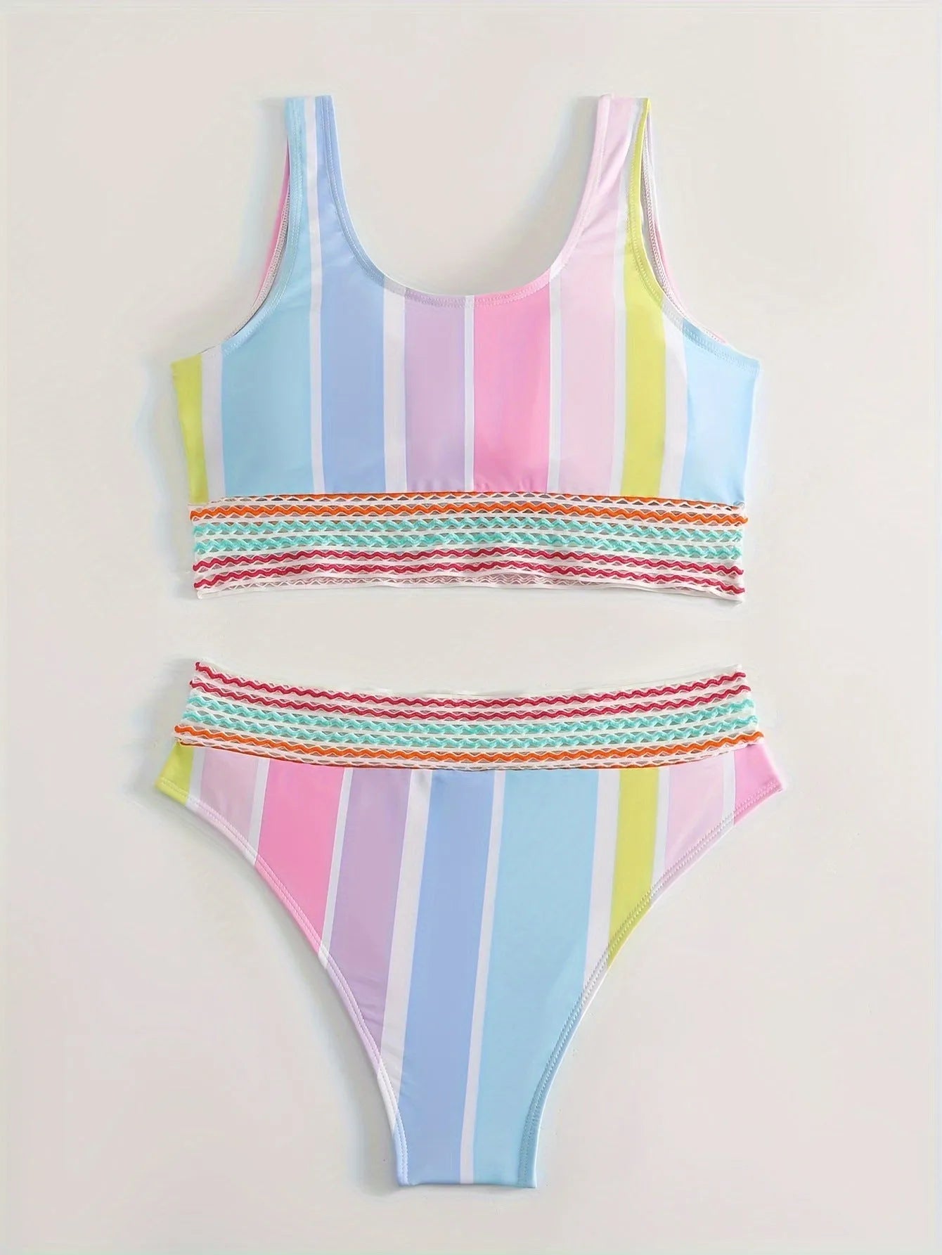 Women's striped blue and white sports bikini set on a mannequin