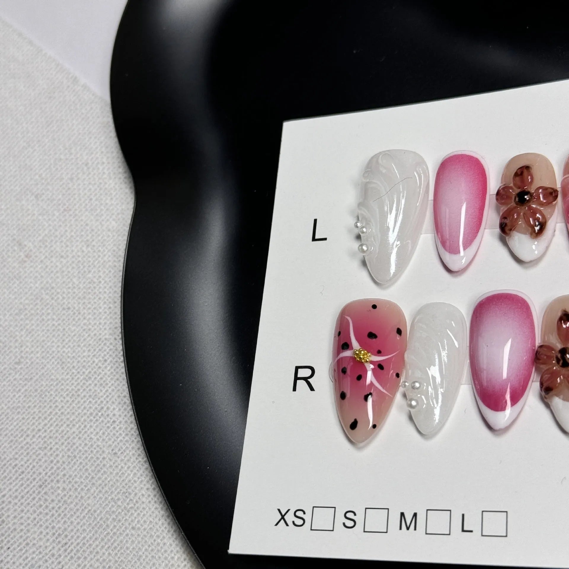 Hand-painted three-dimensional embossed nail art patches in candy colours, showing almond shape.