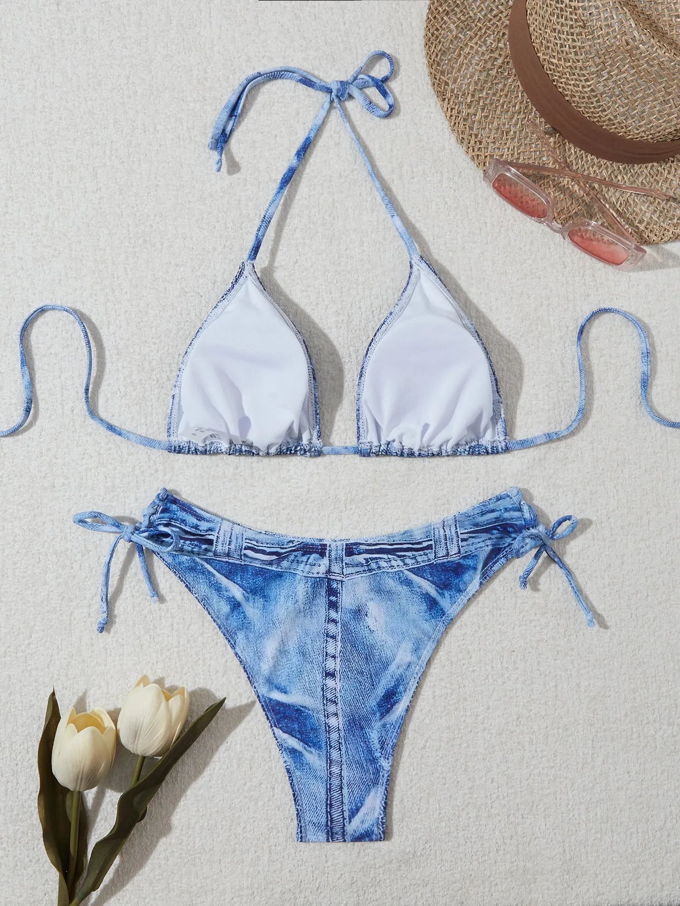Women's denim blue printed bikini set with adjustable straps on mannequin