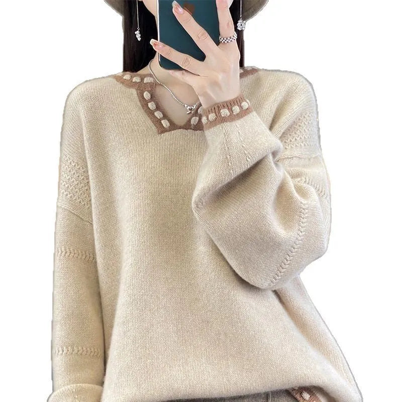 Women's camel and white V-neck viscose pullover sweater with long sleeves.