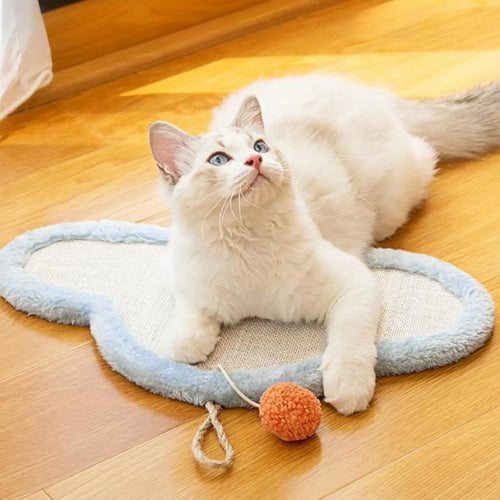 White cat scratching mat with sleeping cat pattern, made from natural sisal, shown mounted on a wall