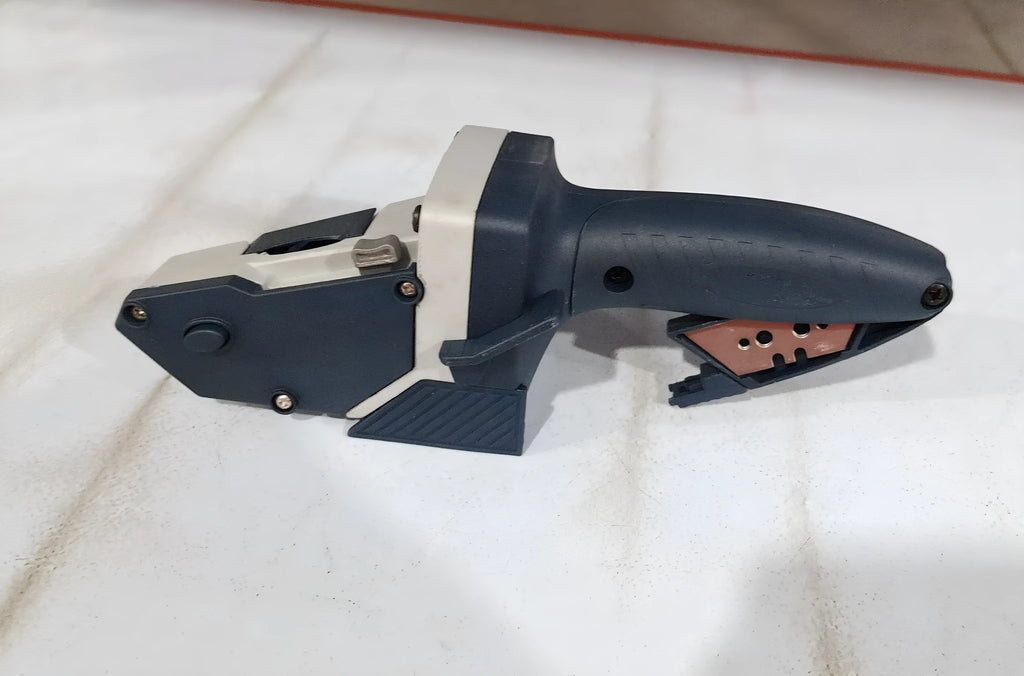Blue multifunctional woodworking cutter with aluminum alloy frame, TPR handle, and integrated tape measure.