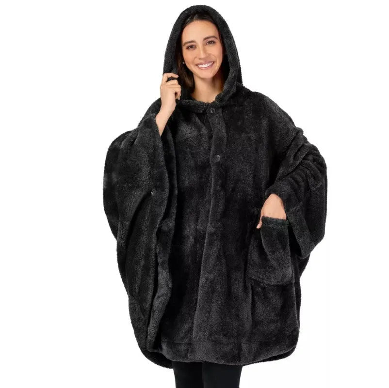 Thick hooded long sleeve bathrobe in black hanging on a hook